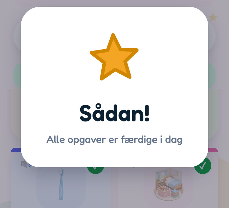 Skærmbillede fra appen: tavlen er mørknet, og et hvidt kort med en stor guldstjerne siger »Sådan! – Alle opgaver er færdige i dag«